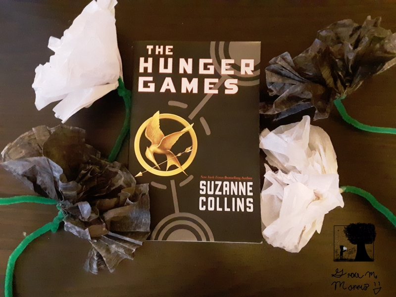 "The Hunger Games" with paper flowers.